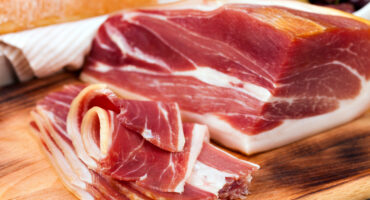 Sliced,Prosciutto,On,A,Wooden,Table