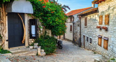 Spectacular,Stone,Paved,Street,And,Restaurant,Entrance,With,Colorful,Mediterranean