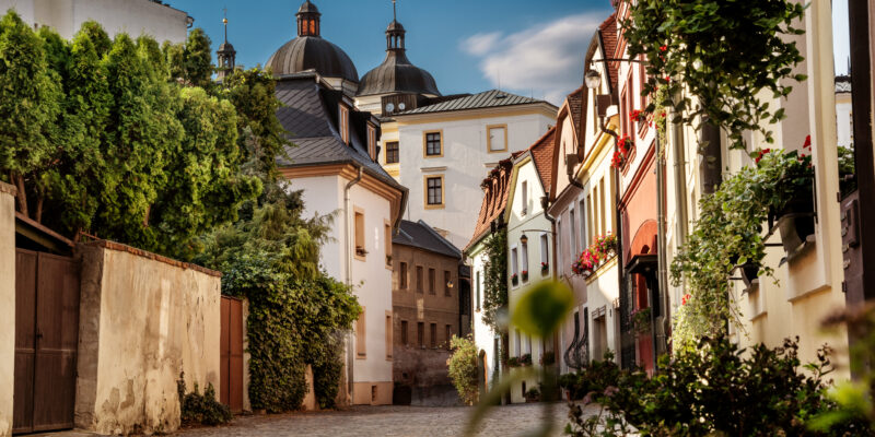 Olomouc, Hrncirska street - Romantic street in the old town with church of st. Michael, Czech Republic. shutterstock_1610126437